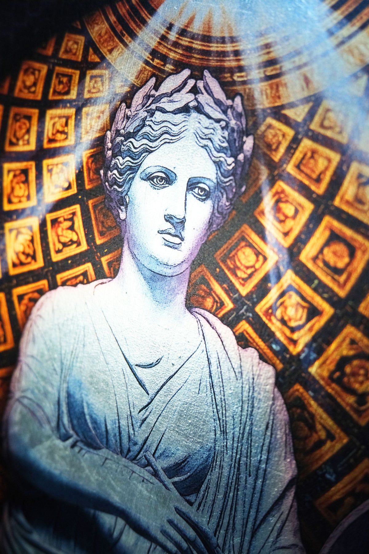 A close-up of a classical-style bust artwork or print showing a woman in draped robes against a patterned golden background with light rays. dark academia decor Clio — Muse of History